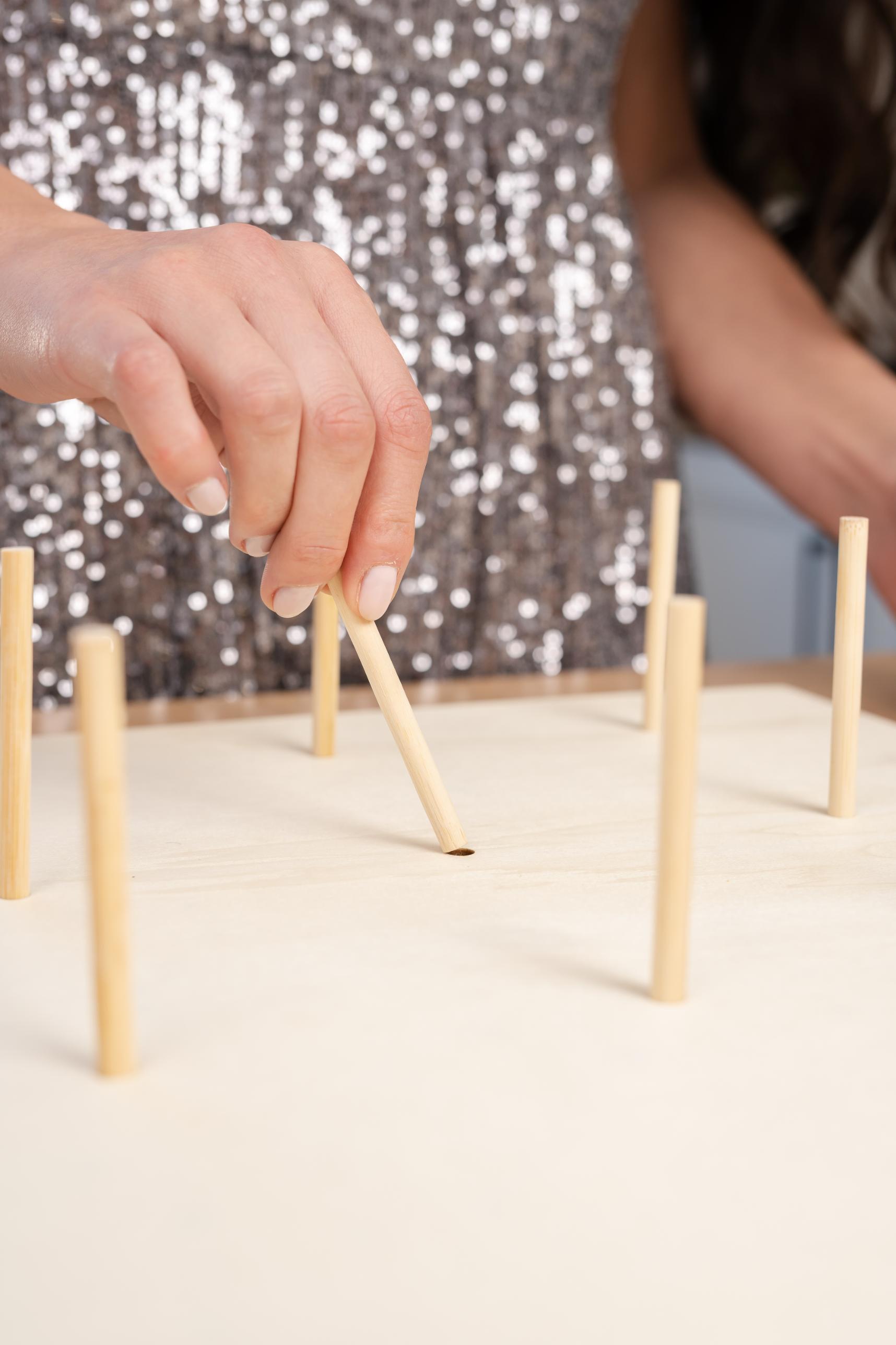 Starpack donut wall stand with multiple tiers, perfect for displaying and serving donuts at parties and events.
