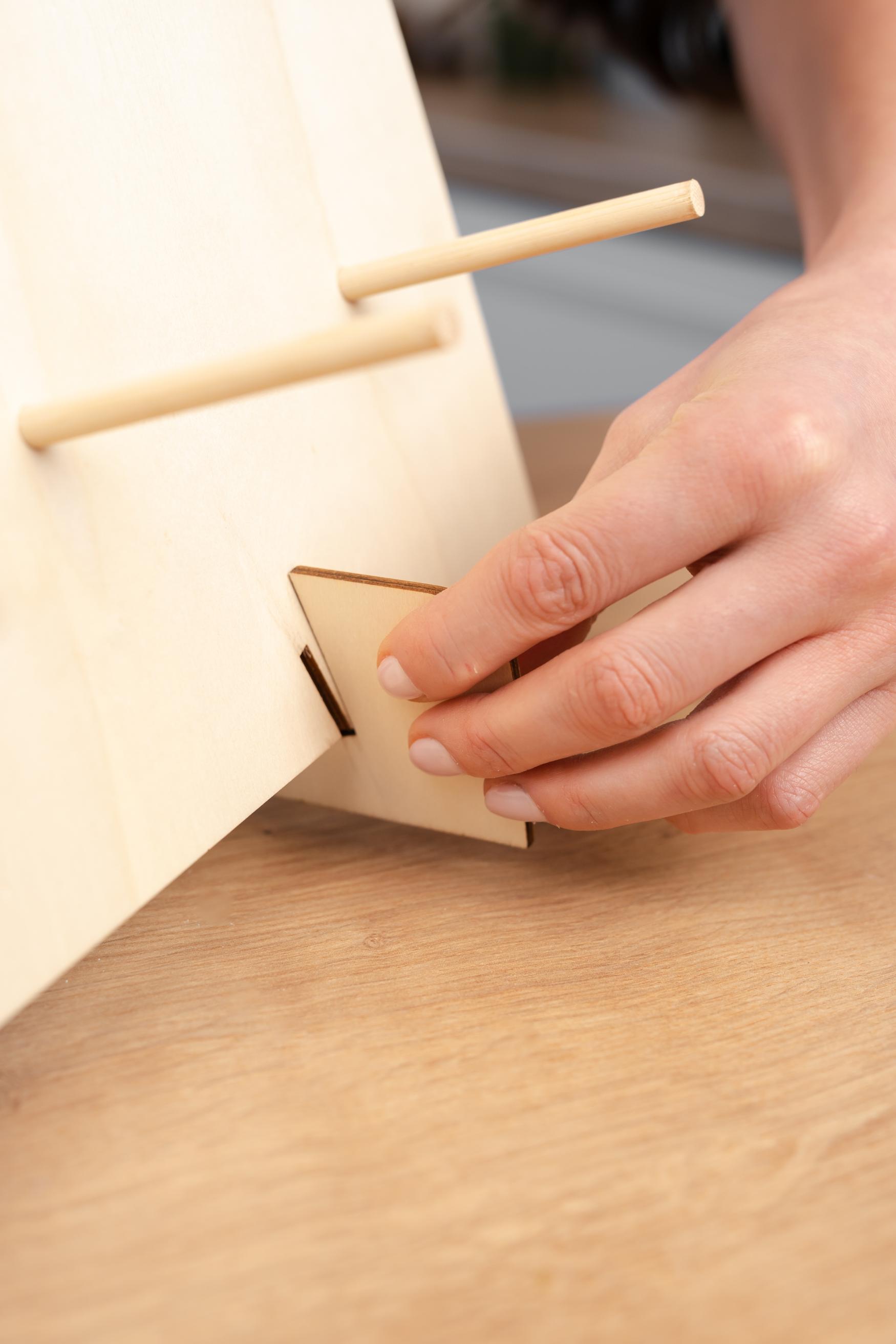 Starpack donut wall stand with multiple tiers, perfect for displaying and serving donuts at parties and events.