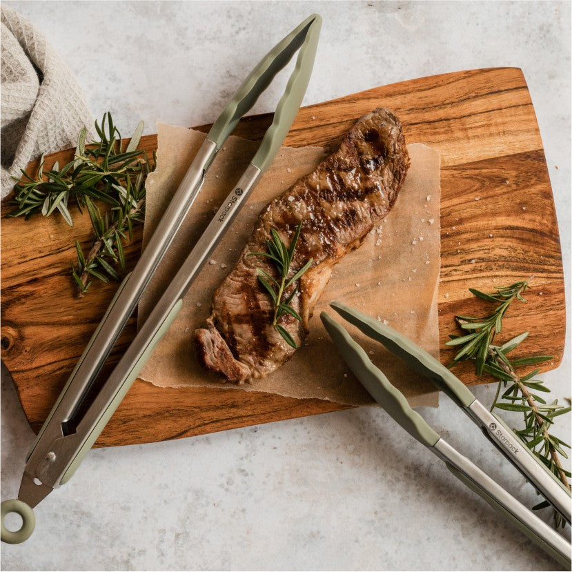 Starpack green silicone tongs with a heat-resistant head and ergonomic handle, shown in a collection setting on the homepage, ideal for kitchen use.