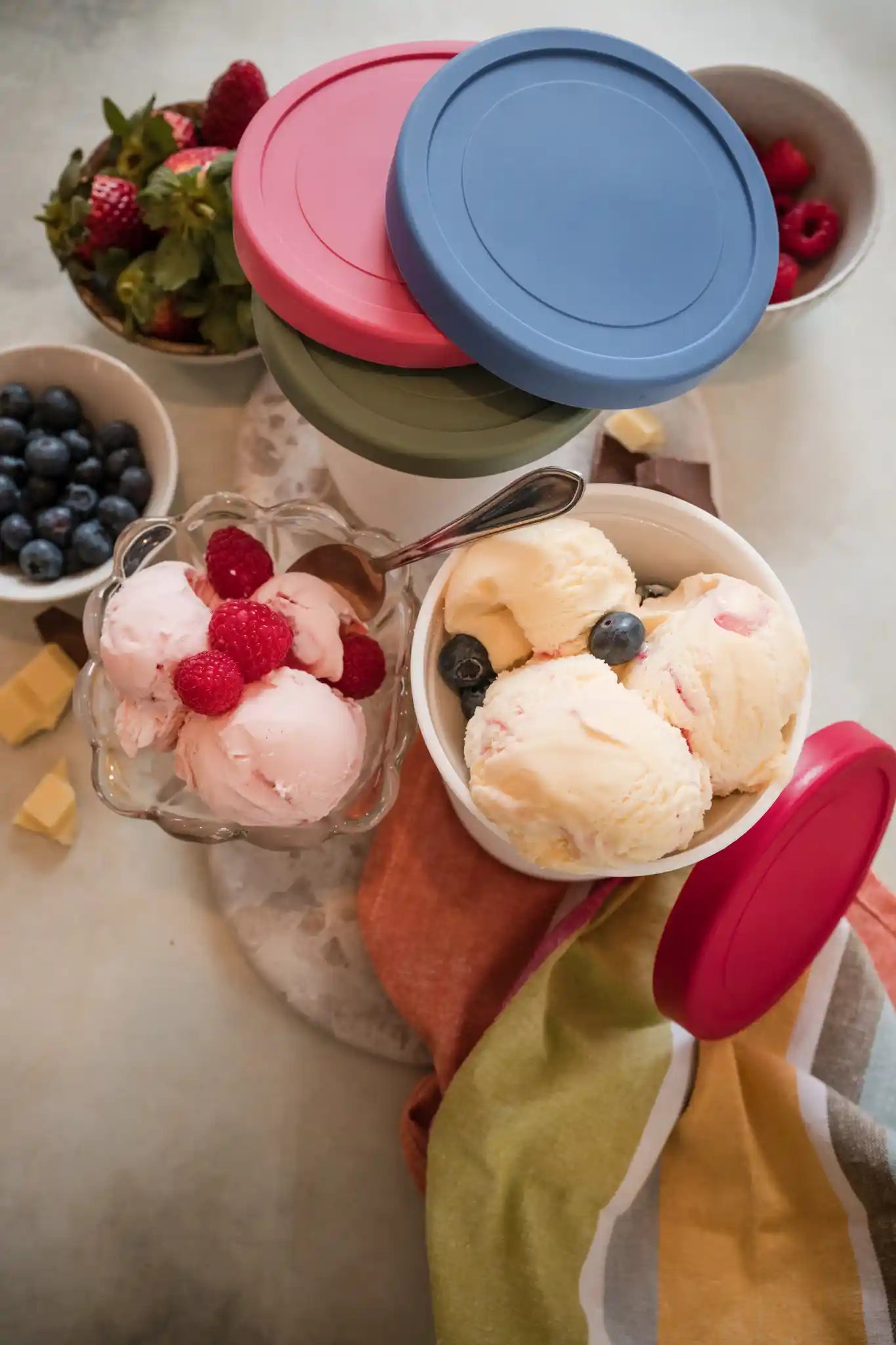 Starpack ice cream freezer storage containers with colorful, leak-proof silicone lids, designed for easy stacking and frost-free storage.