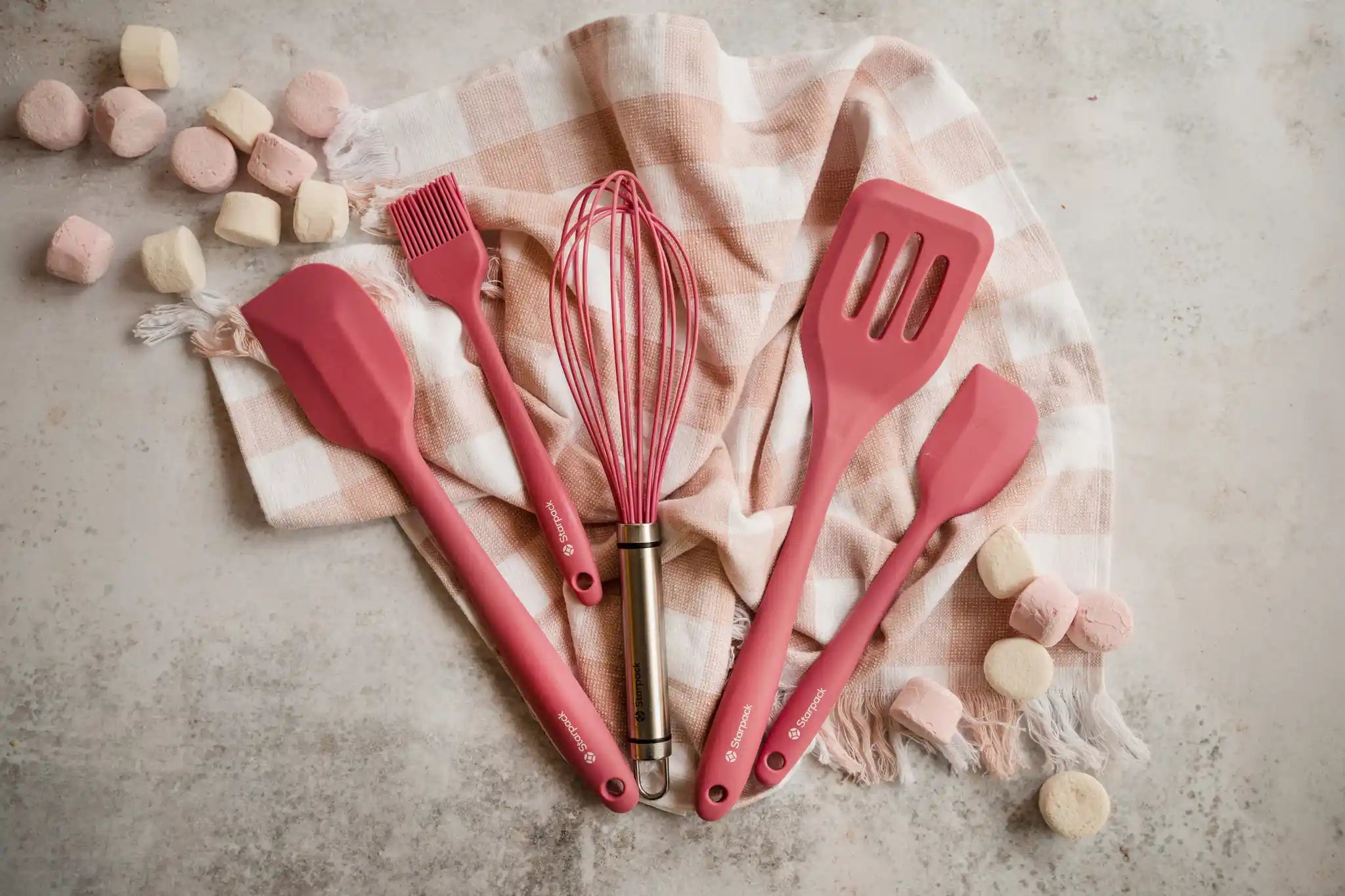 Starpack silicone kitchen utensils set, featuring various tools with non-stick heads and sturdy handles for versatile cooking.