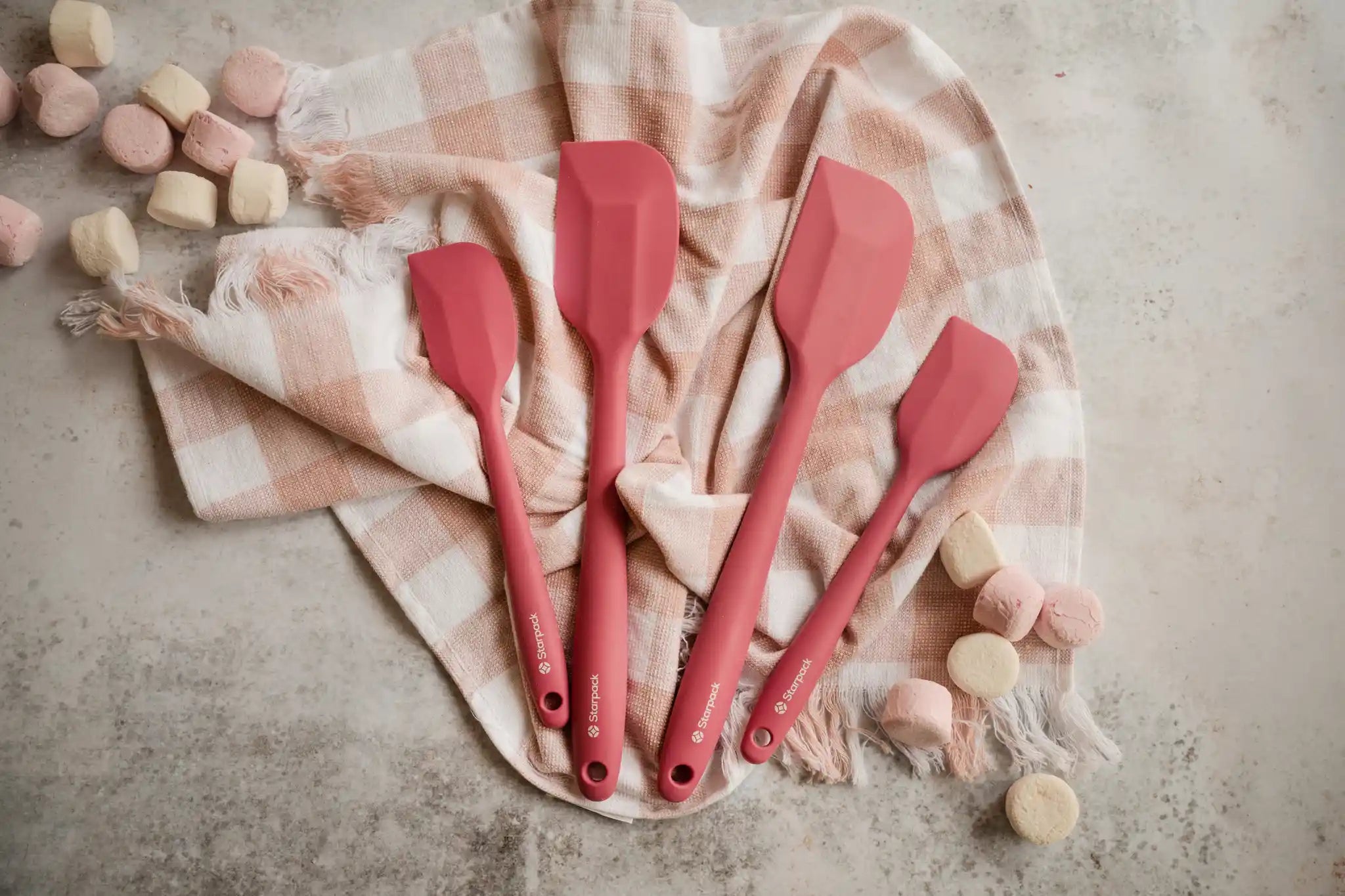 Starpack silicone kitchen utensils set, featuring various tools with non-stick heads and sturdy handles for versatile cooking.